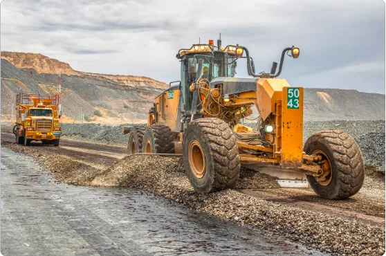 Groundworker operating heavy machinery
